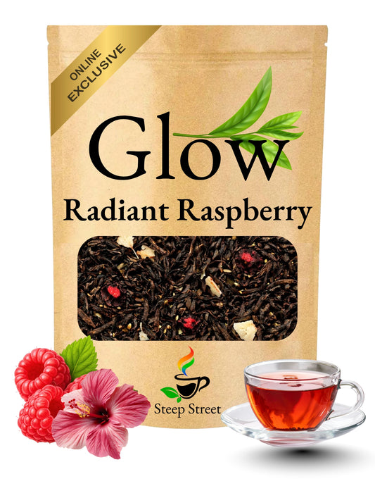 Tea package labeled 'Glow Radiant Raspberry' with a cup of tea and raspberries on a white background