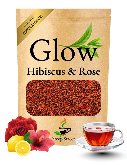 Glow Hibiscus & Rose tea package with tea leaves, flowers, and a cup of tea on a white background.